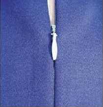 An invisible zipper sewn into blue fabric: only a seam line and a small teardrop-shaped pull show