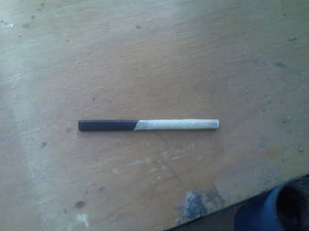 Figure 1.12 Sandpaper wrapping on a wooden stick.