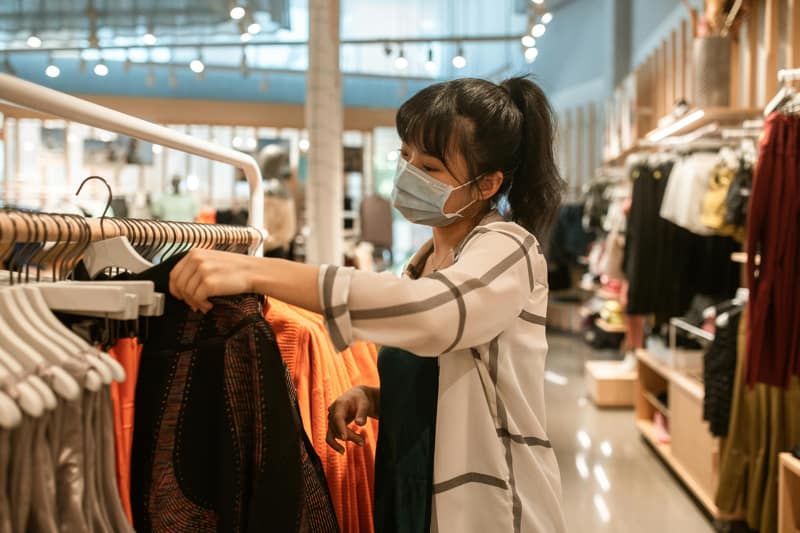customers examining trendy garments