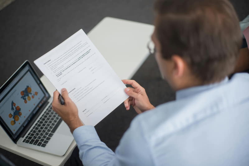 professional reviewing digital trade documents