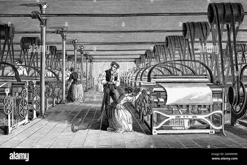 textile mill with workers operating powerlooms