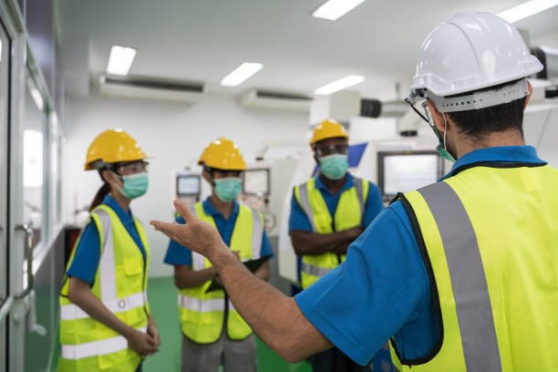 textile mill workers participating in a safety training session